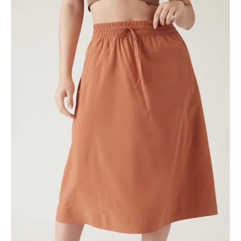 Athleta Arrival Skirt Womens 20UPF Pockets Midi Comfy Stretch Sunbaked Clay Sz 8